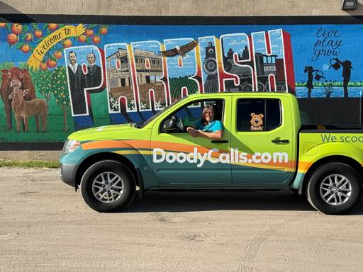 A green truck with a person in the driver's seat
AI-generated content may be incorrect.